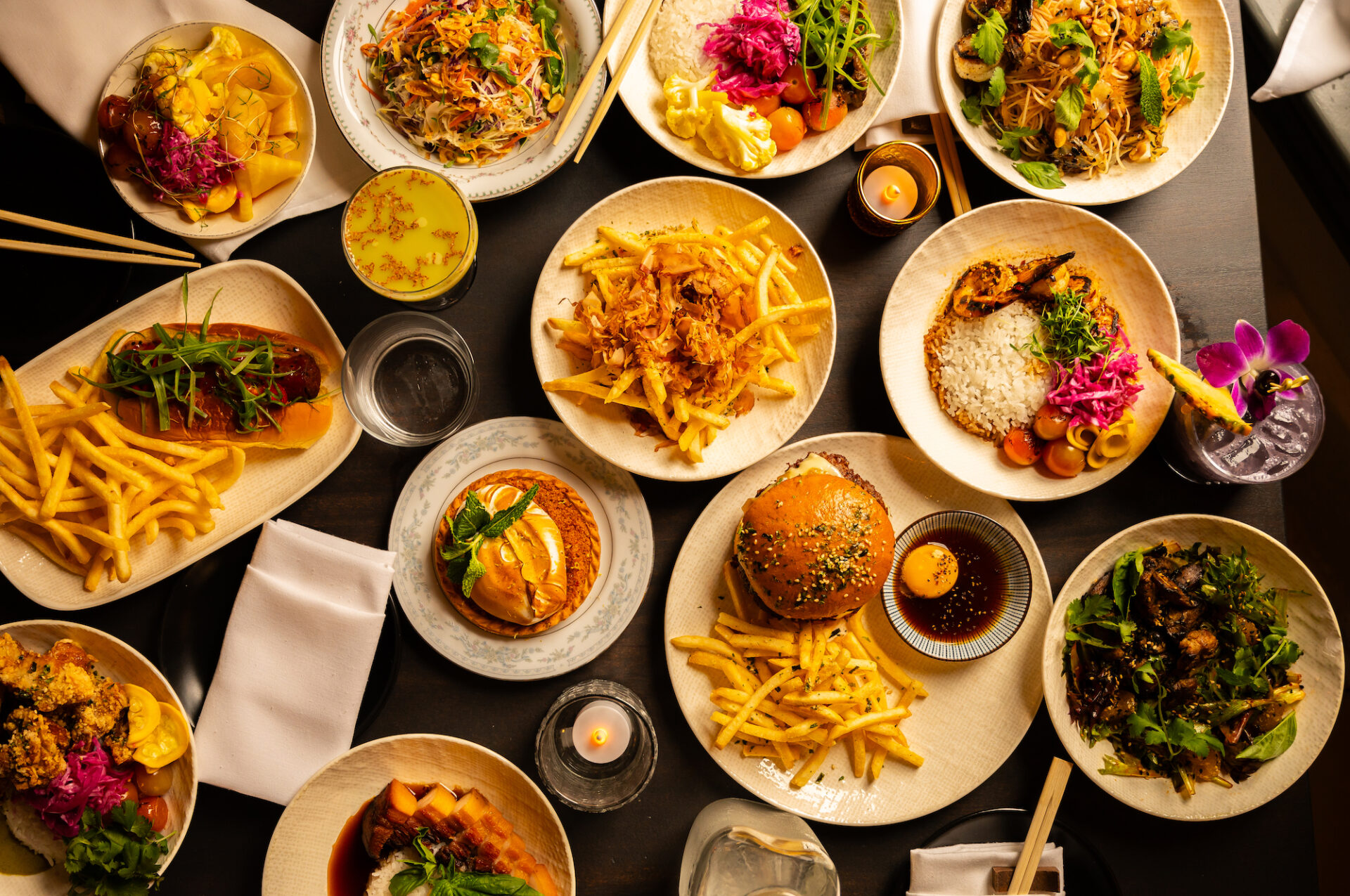 several plates on table with various menu items from Tokyo Cowboy