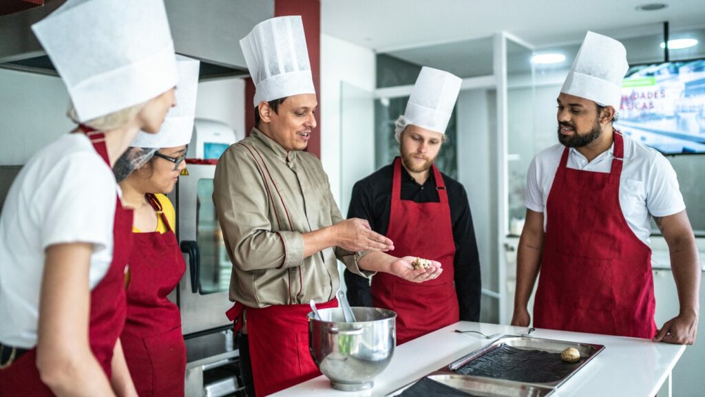 Restaurant Consultant teaching new restaurant owners cooking techniques.