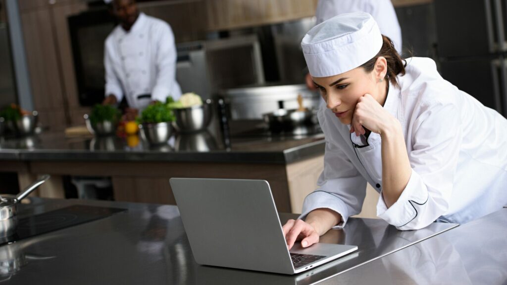 Chef on computer viewing all in one websites